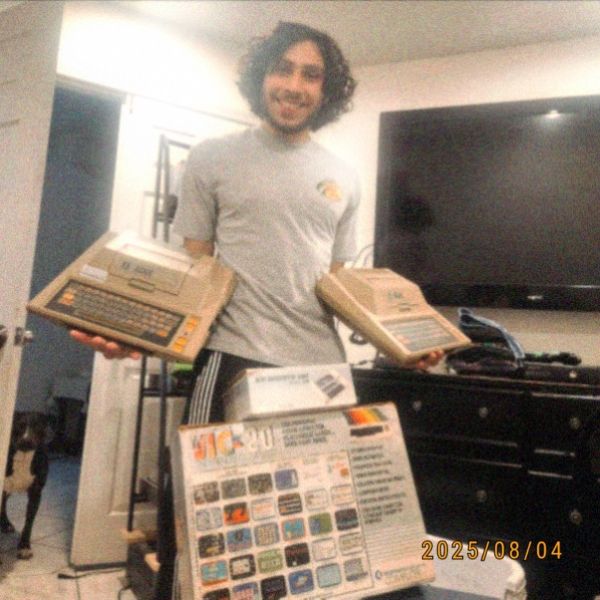 Daniel holding Atari 400s